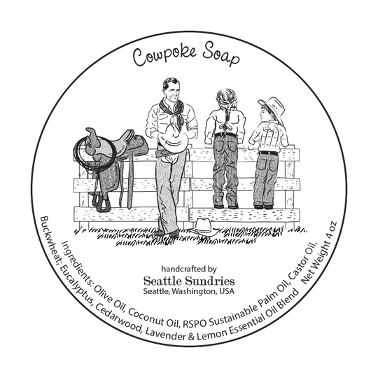 Circular label for Cowpoke Soap featuring illustrations of a cowboy and two children on a fence with text detailing product information.