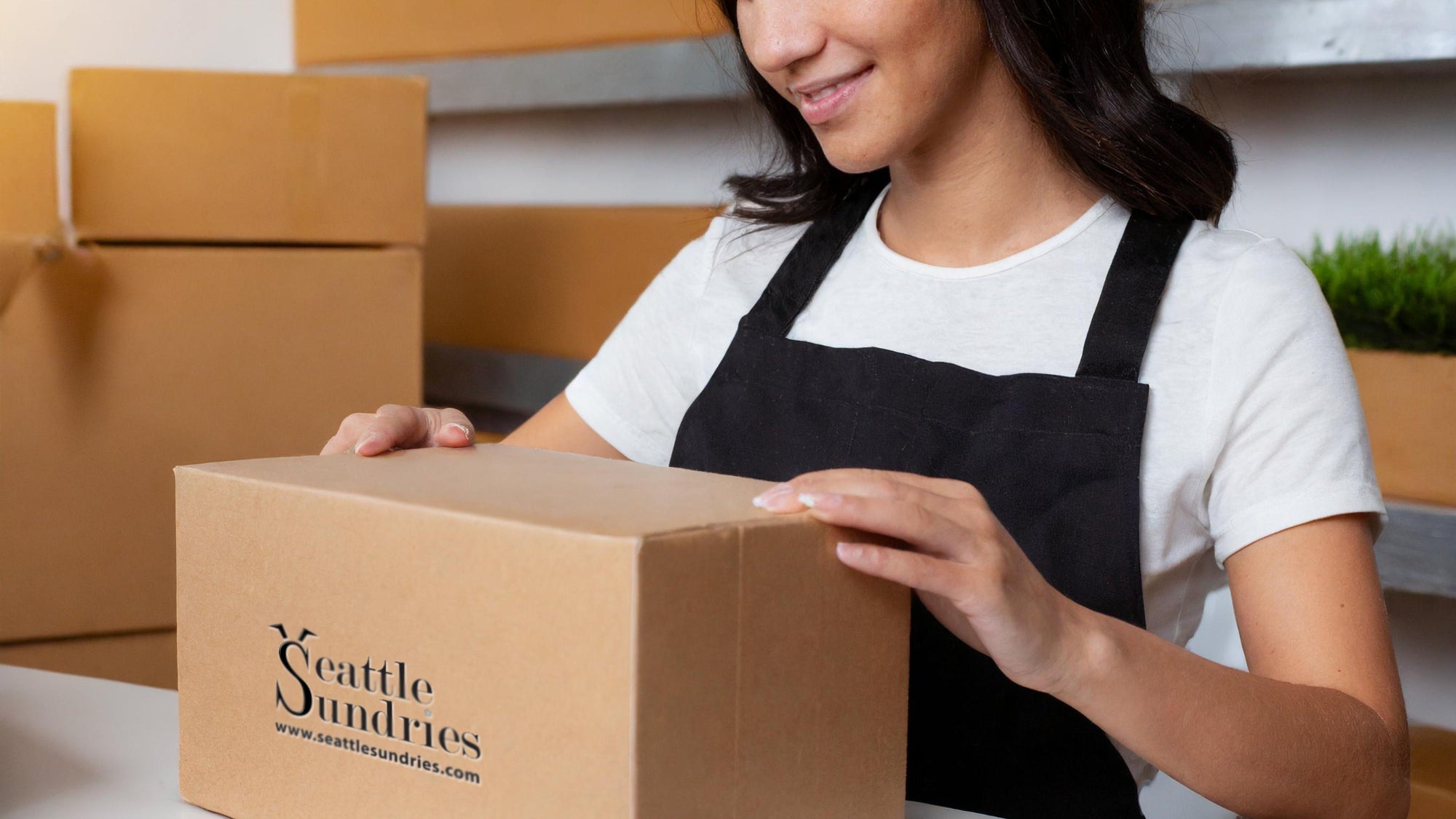 woman opening Seattle Sundries box